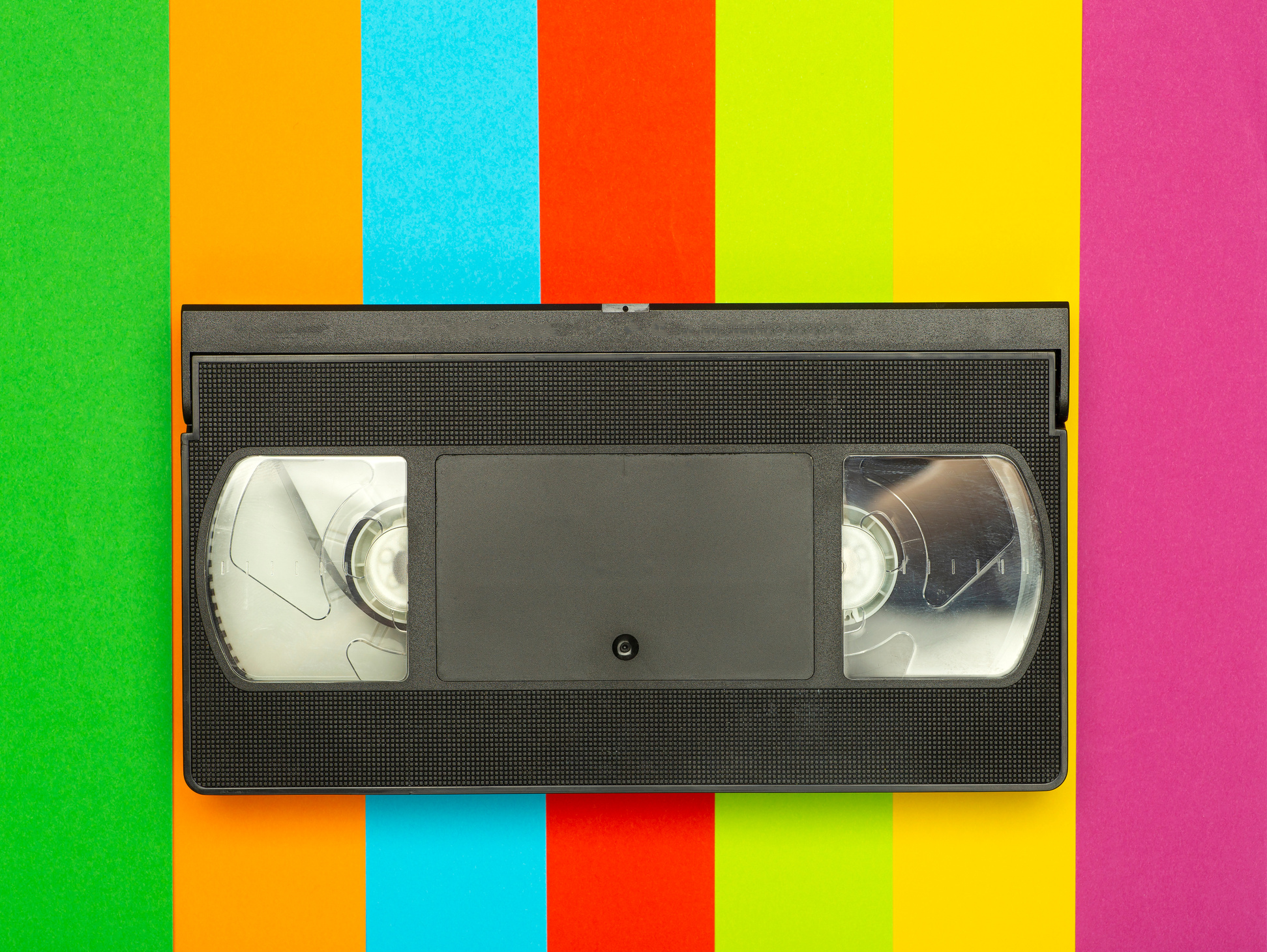 Aesthetics of the 80s and 90s. Videocassette (VHS) on a color background. Video, minimal, retro concept